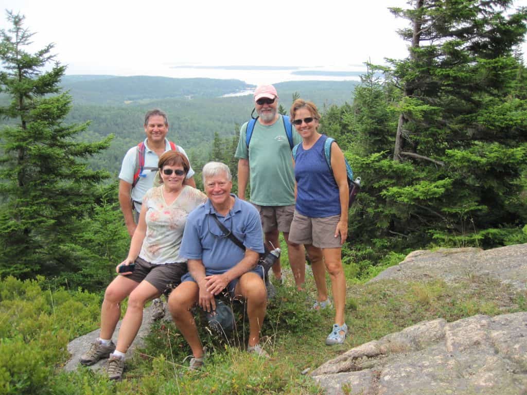 Visitors hiking in Acadia woods trails