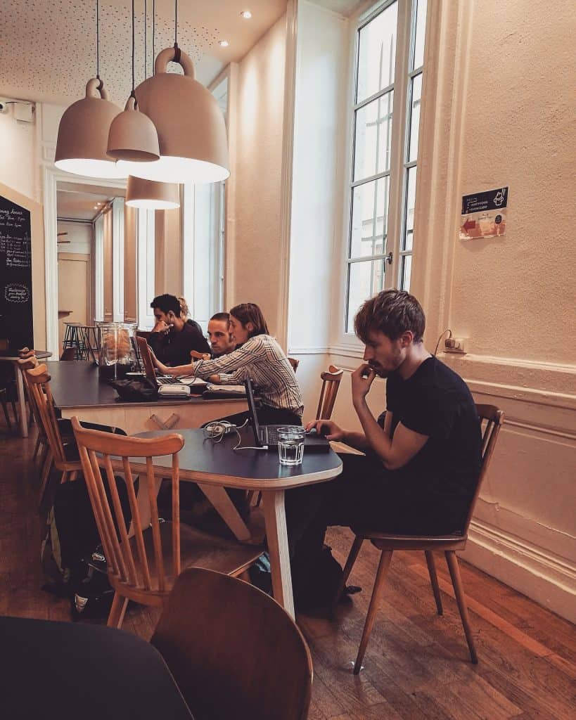 People working remotely at an Internet cafe