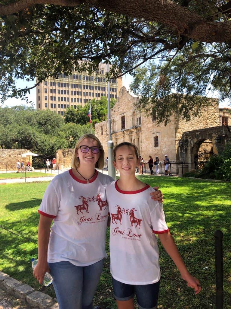 Girls at The Alamo wearing Ten Apple Farm shirts