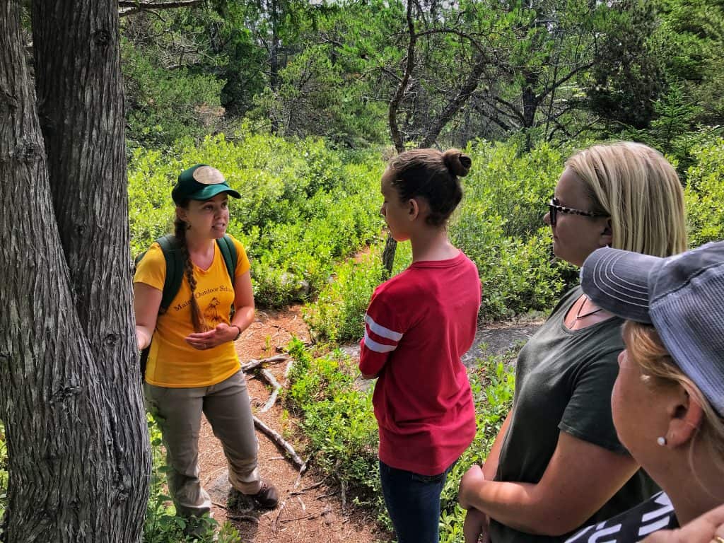 Hazel Stark leading family on hike through Hollingsworth Trail in Steuben